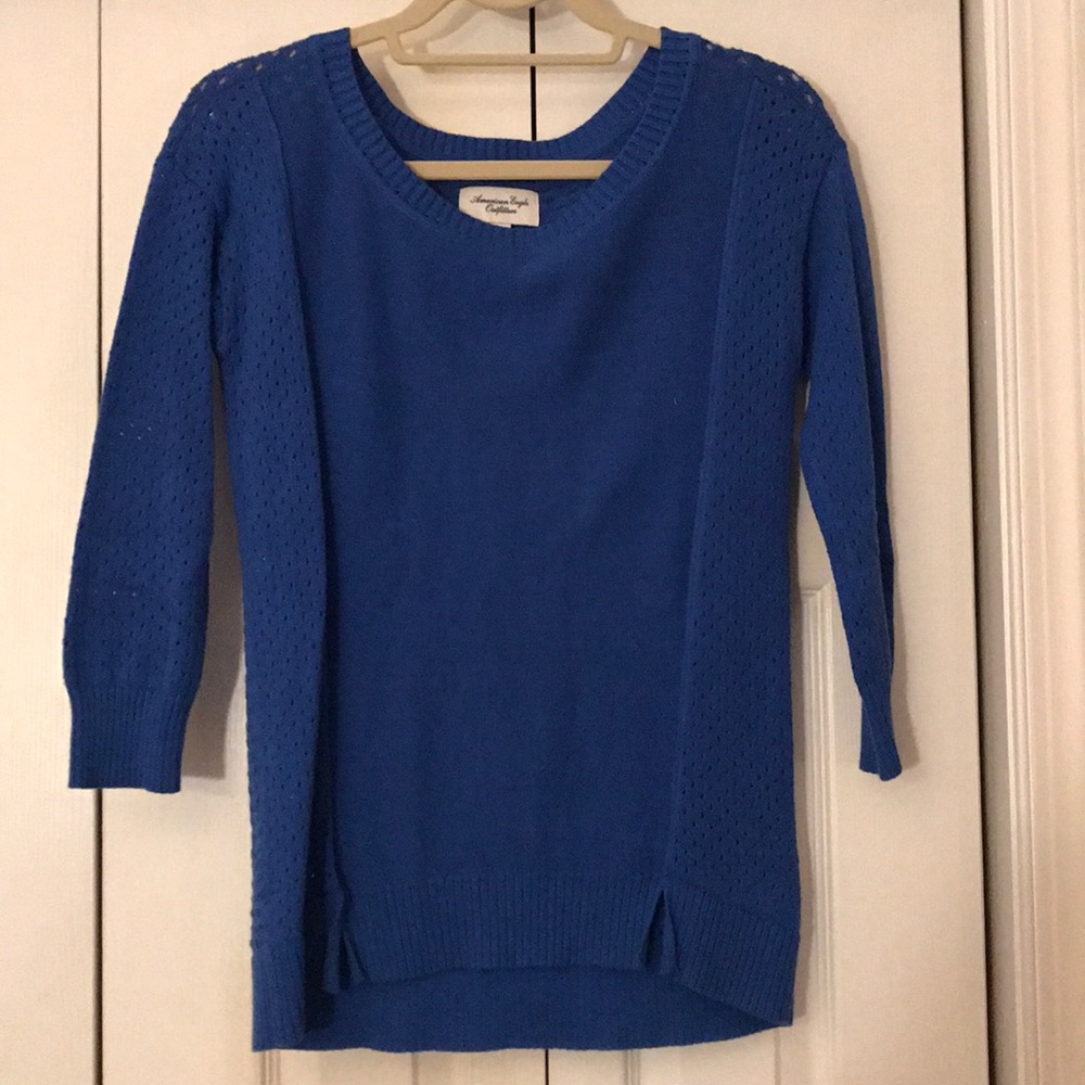 Blue sweater with holes and quarter length sleeves